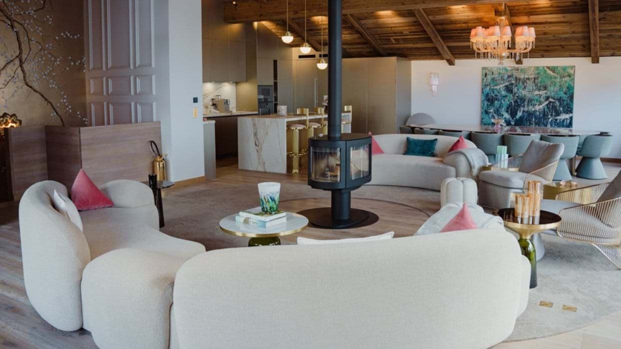 Open-plan living area with 360-degree wood stove and marble breakfast bar