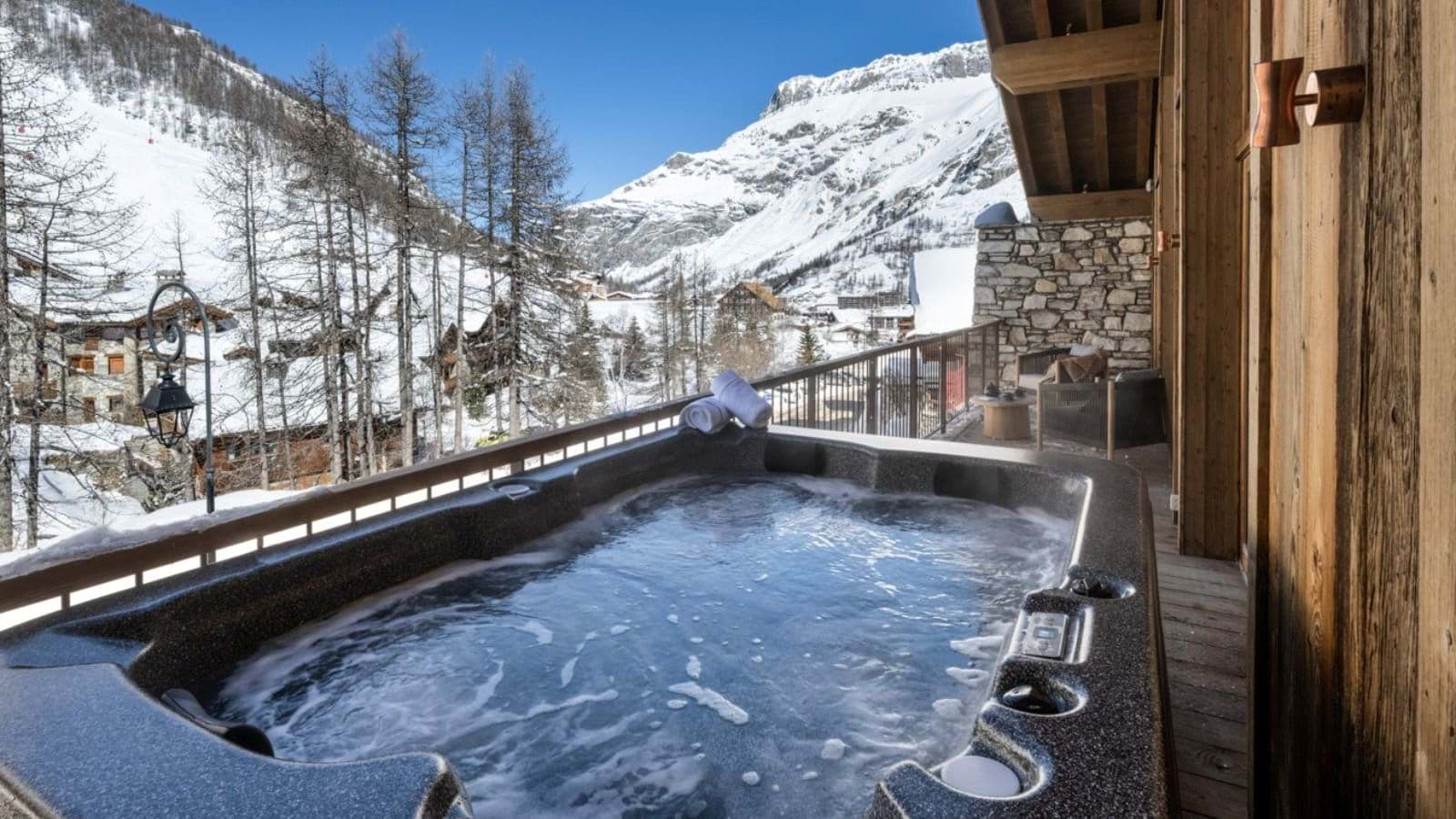 Private balcony hot tub with mountain and valley views