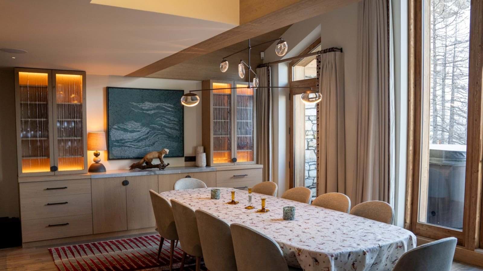 Dining area seating 10 with built-in cabinetry and outdoor terrace access