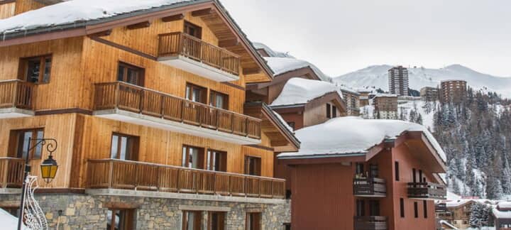 Wood and stone chalet with private balconies; village and mountain views