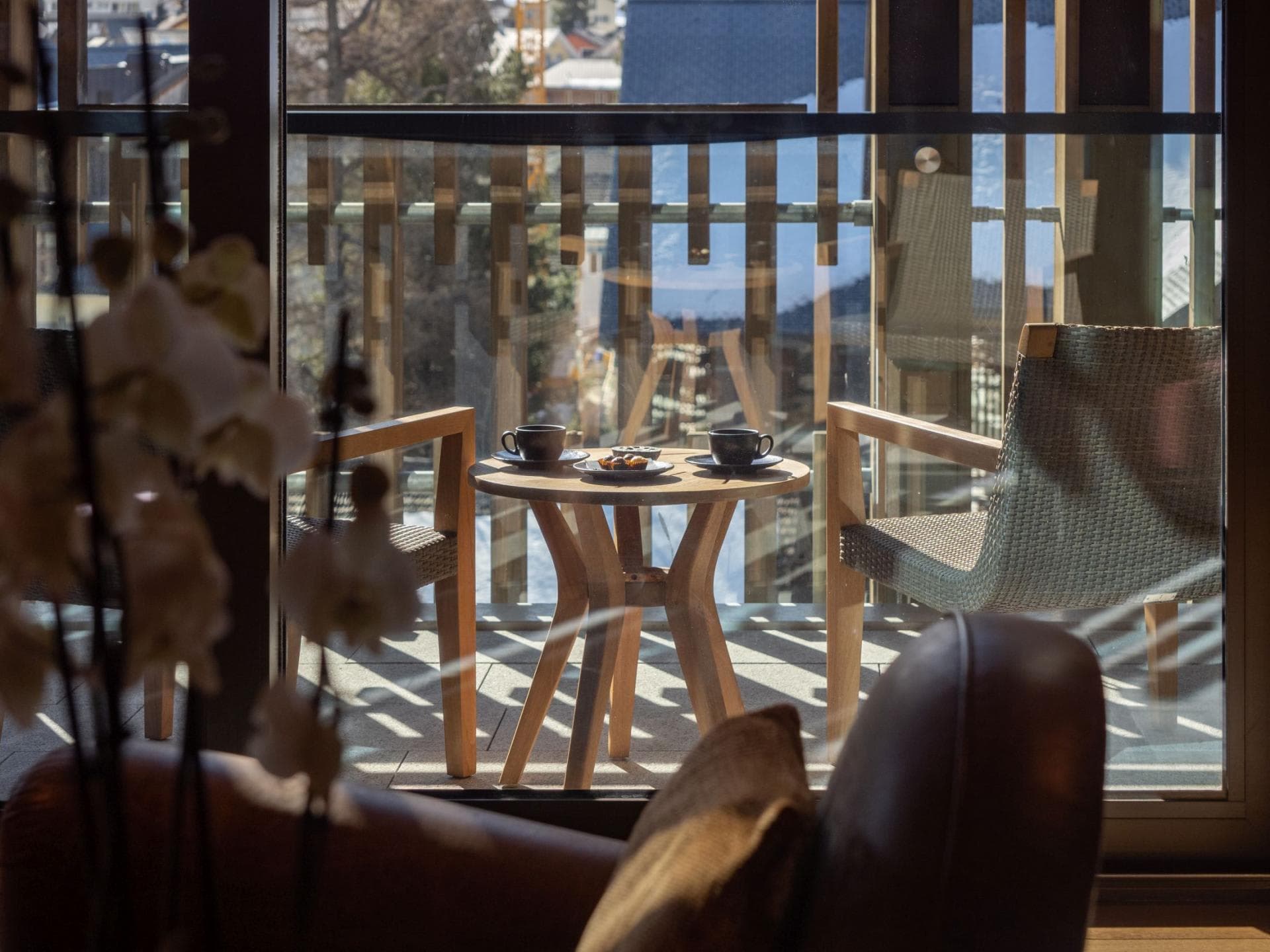 Private balcony with bistro seating for two and village views