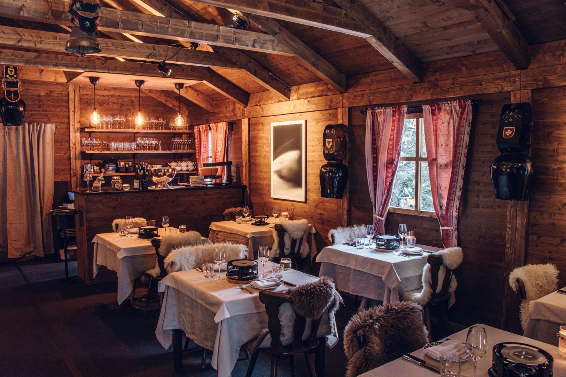 Dining area with exposed timber beams and seating for 16