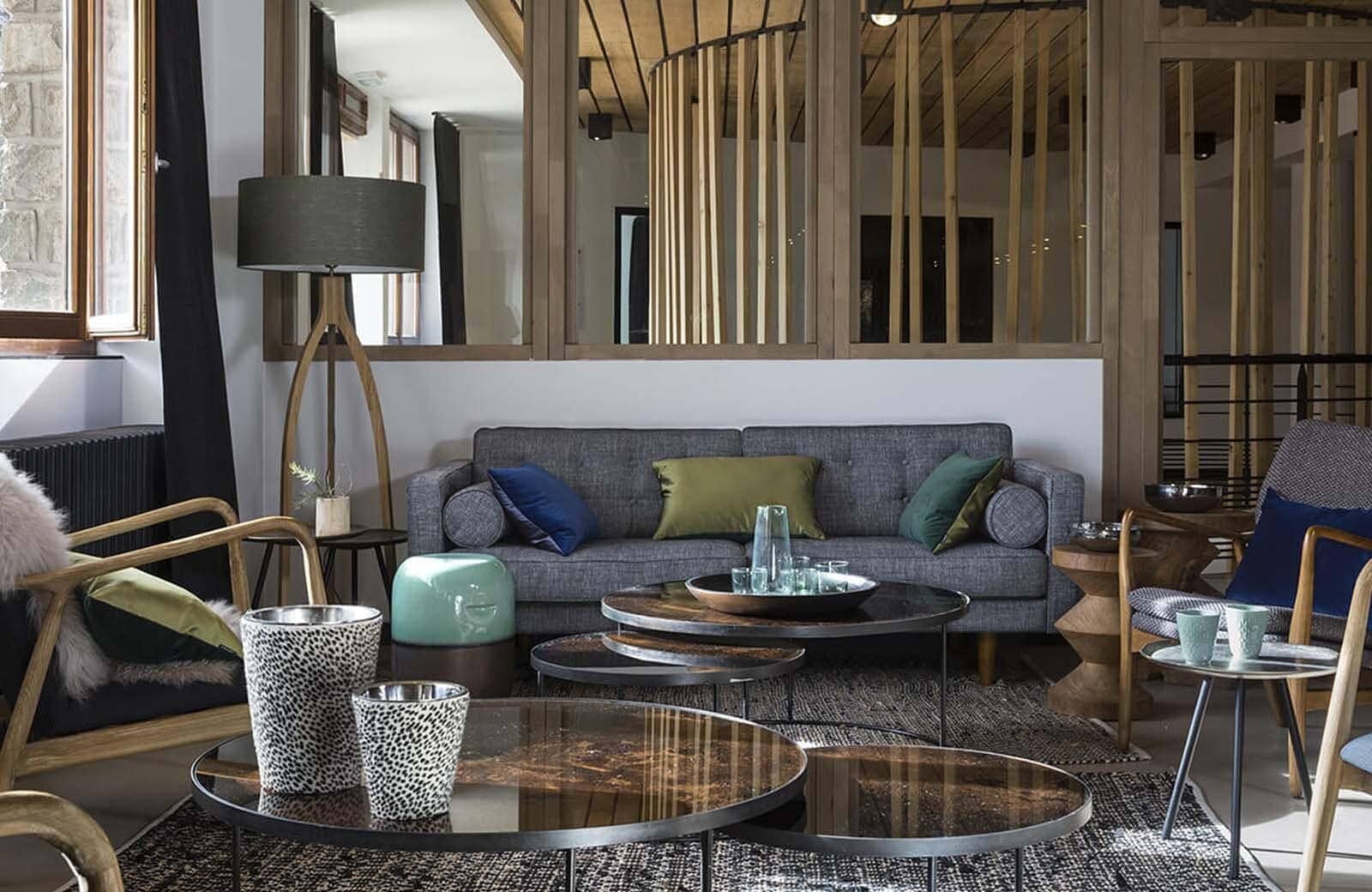 Living area with sofa seating and nesting coffee tables