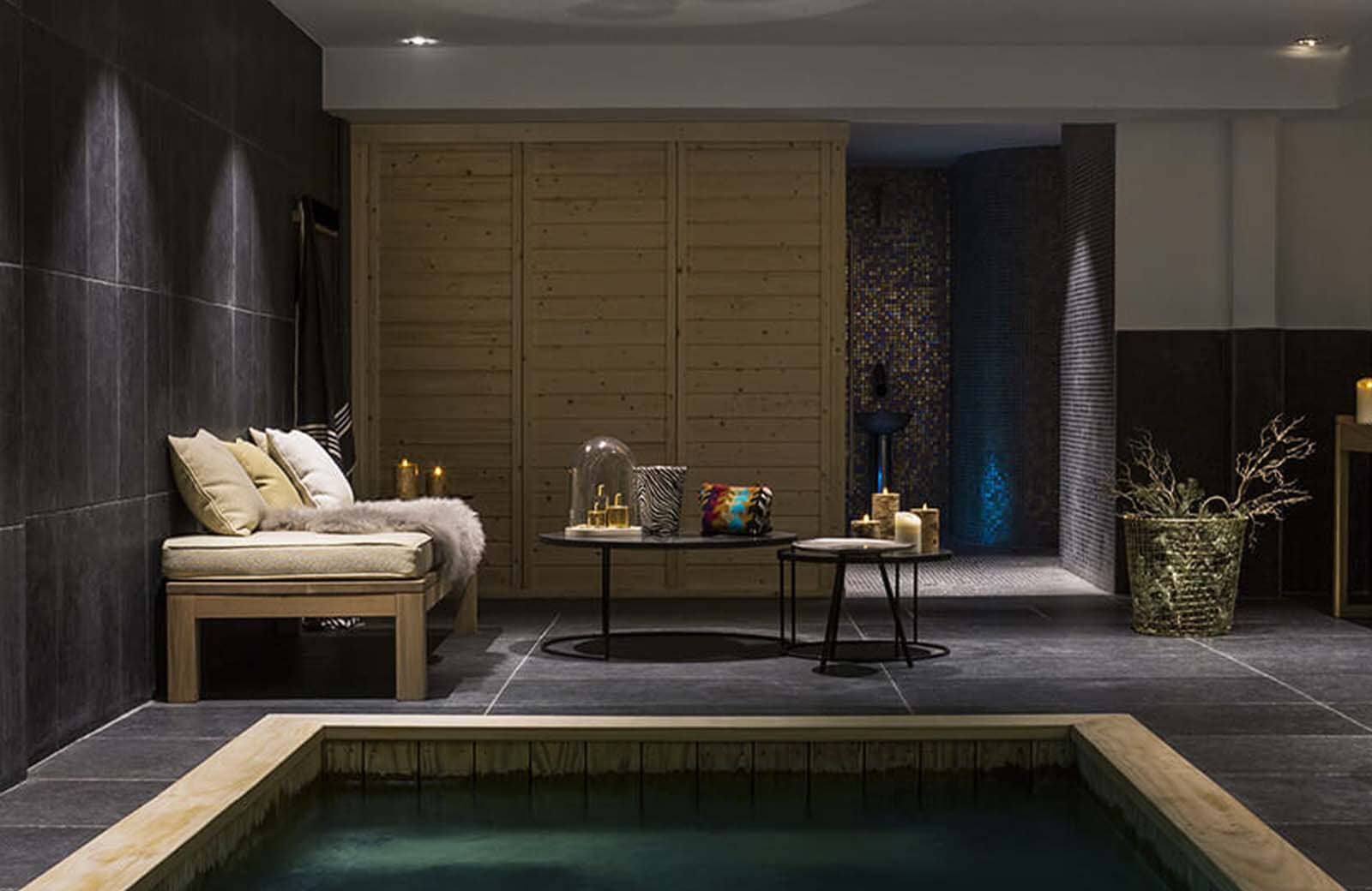 Spa area with indoor hot tub and walk-in mosaic shower