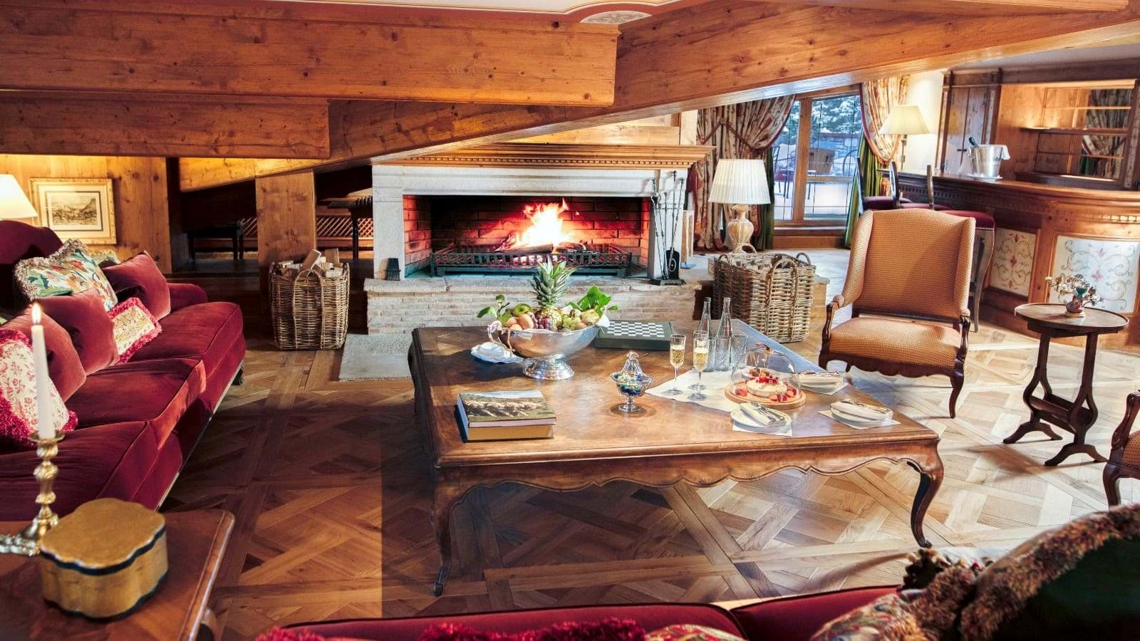 Living area with wood-burning fireplace, parquet floors, and wet bar