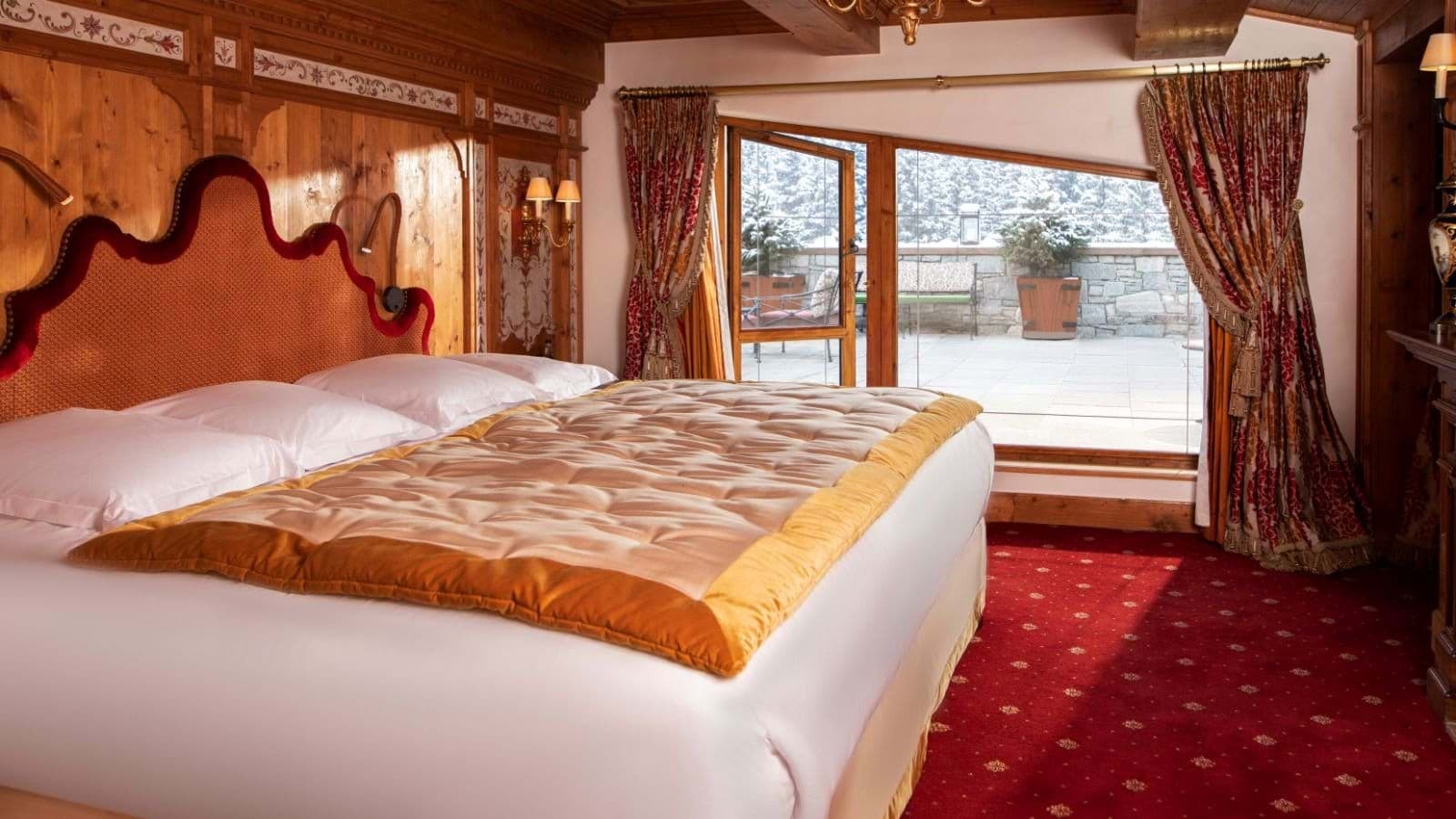 Primary bedroom with king bed and private terrace access