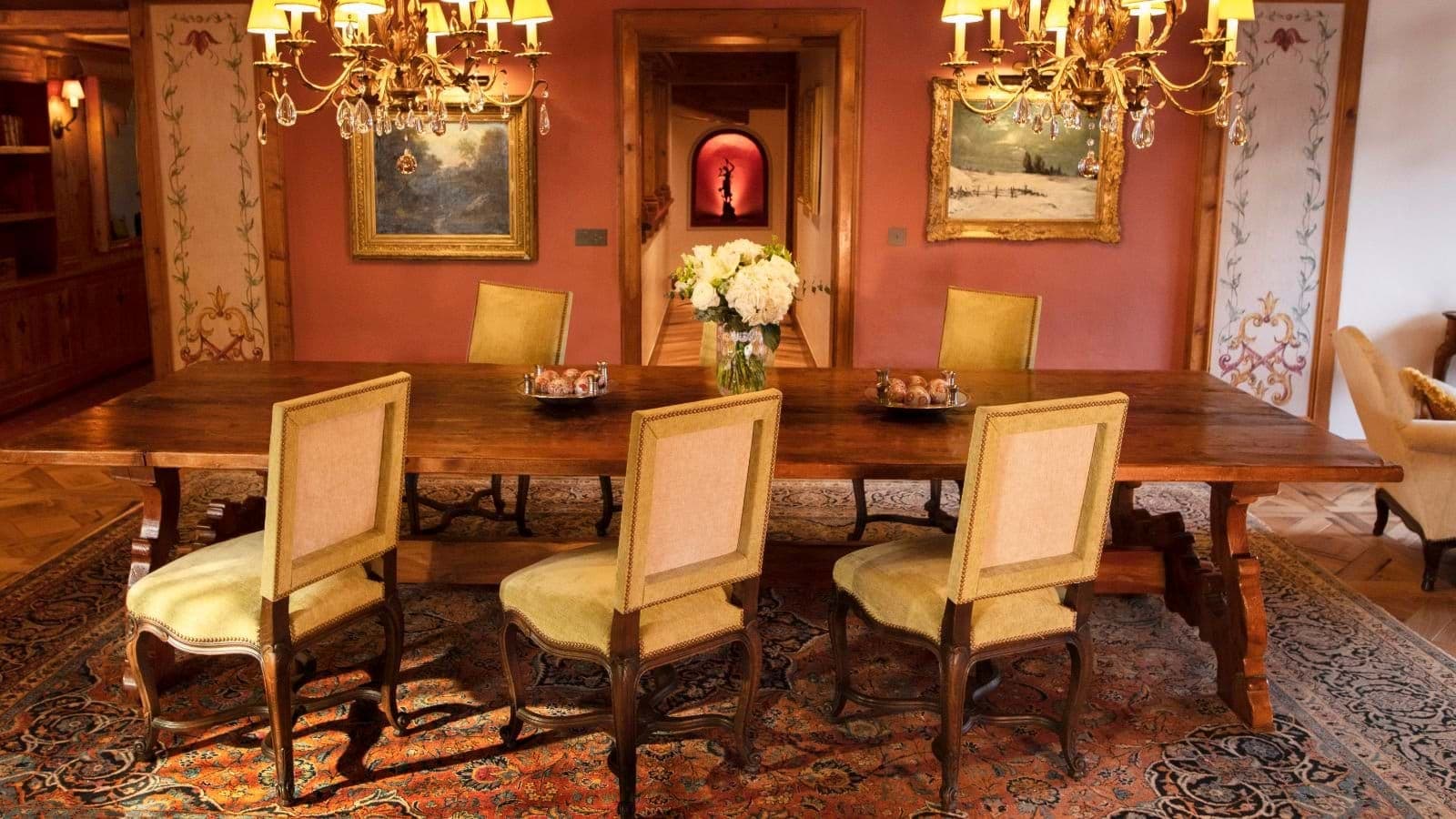 Formal dining room with seating for 10 and dual crystal chandeliers