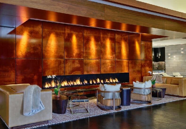 Lobby lounge with wide linear fireplace and varied soft seating