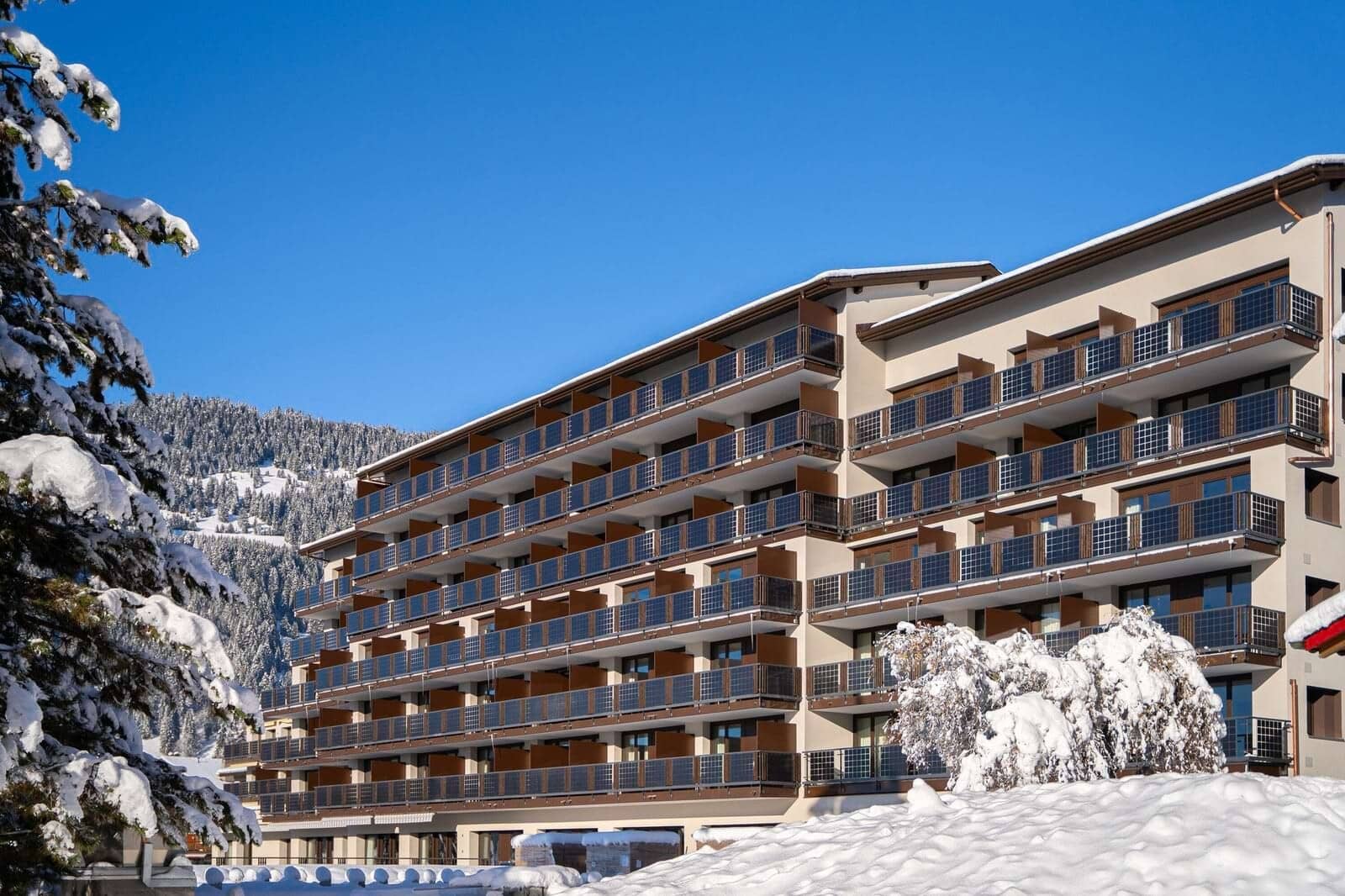 Ski-in/ski-out apartment complex with private balconies and mountain views